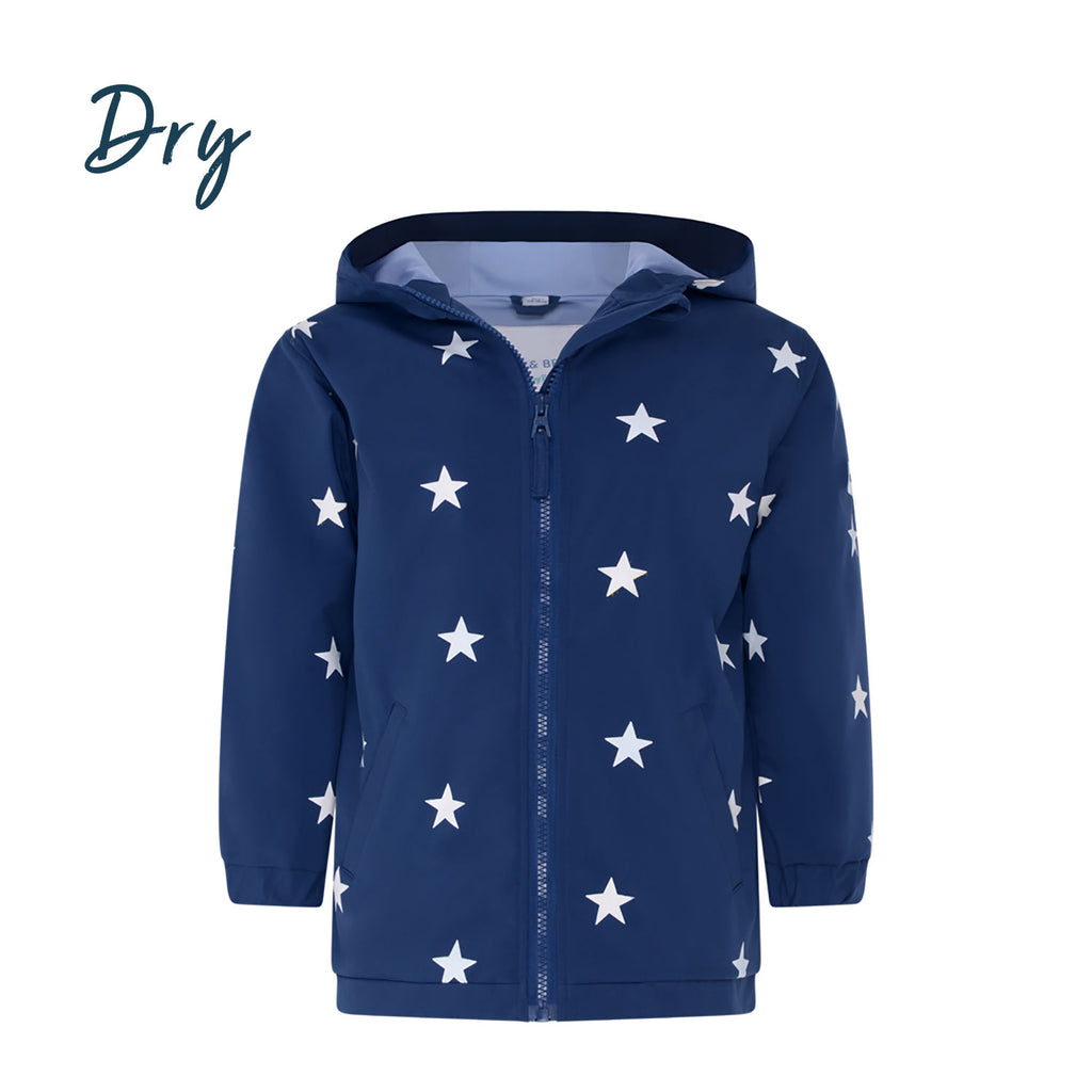 Blue star kids colour changing raincoat by Holly and Beau. Front view showing the dry colour changing raincoat.