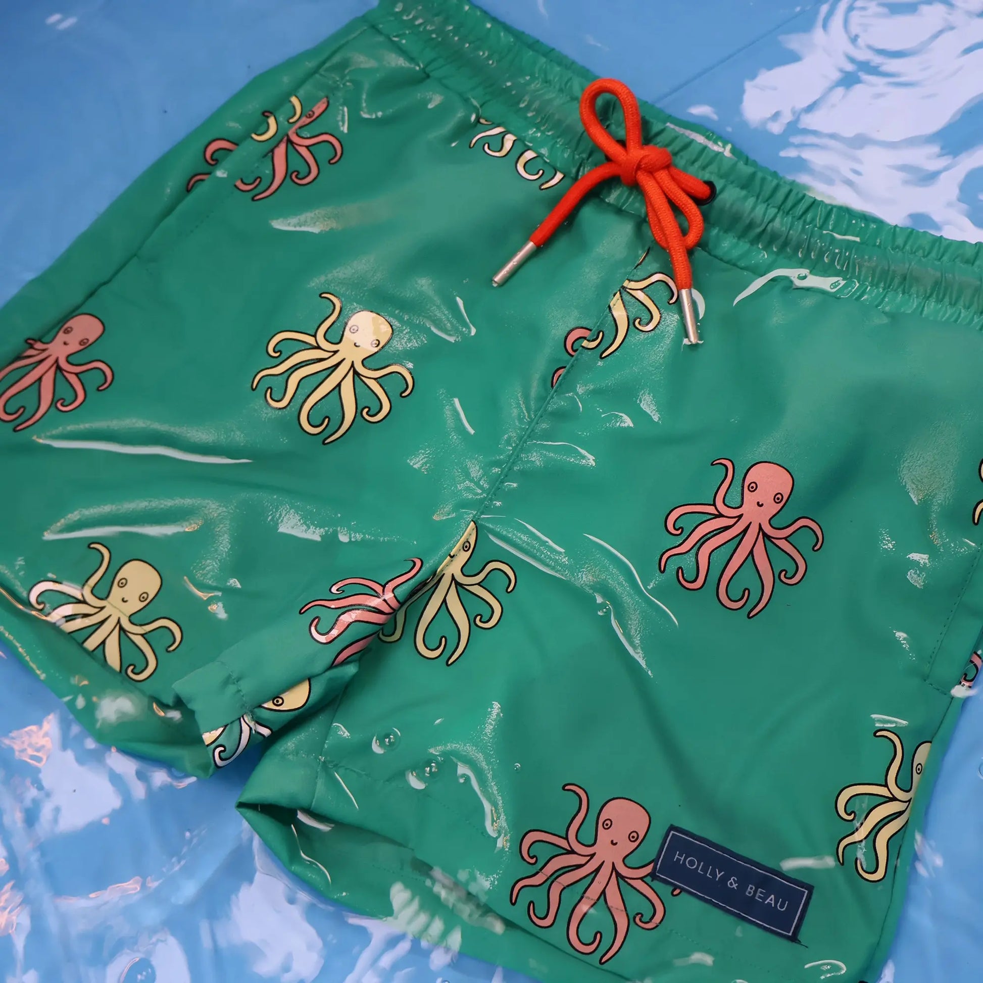 Holly and Beau octopus colour changing swim shorts in the water