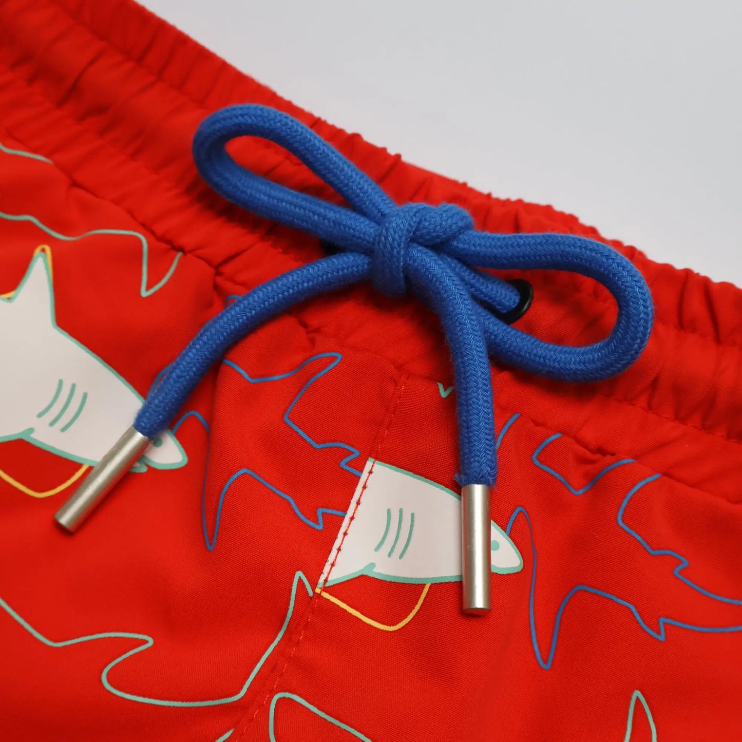 Holly and Beau Red sharks boys colour changing swim shorts. Front detail drawstring 