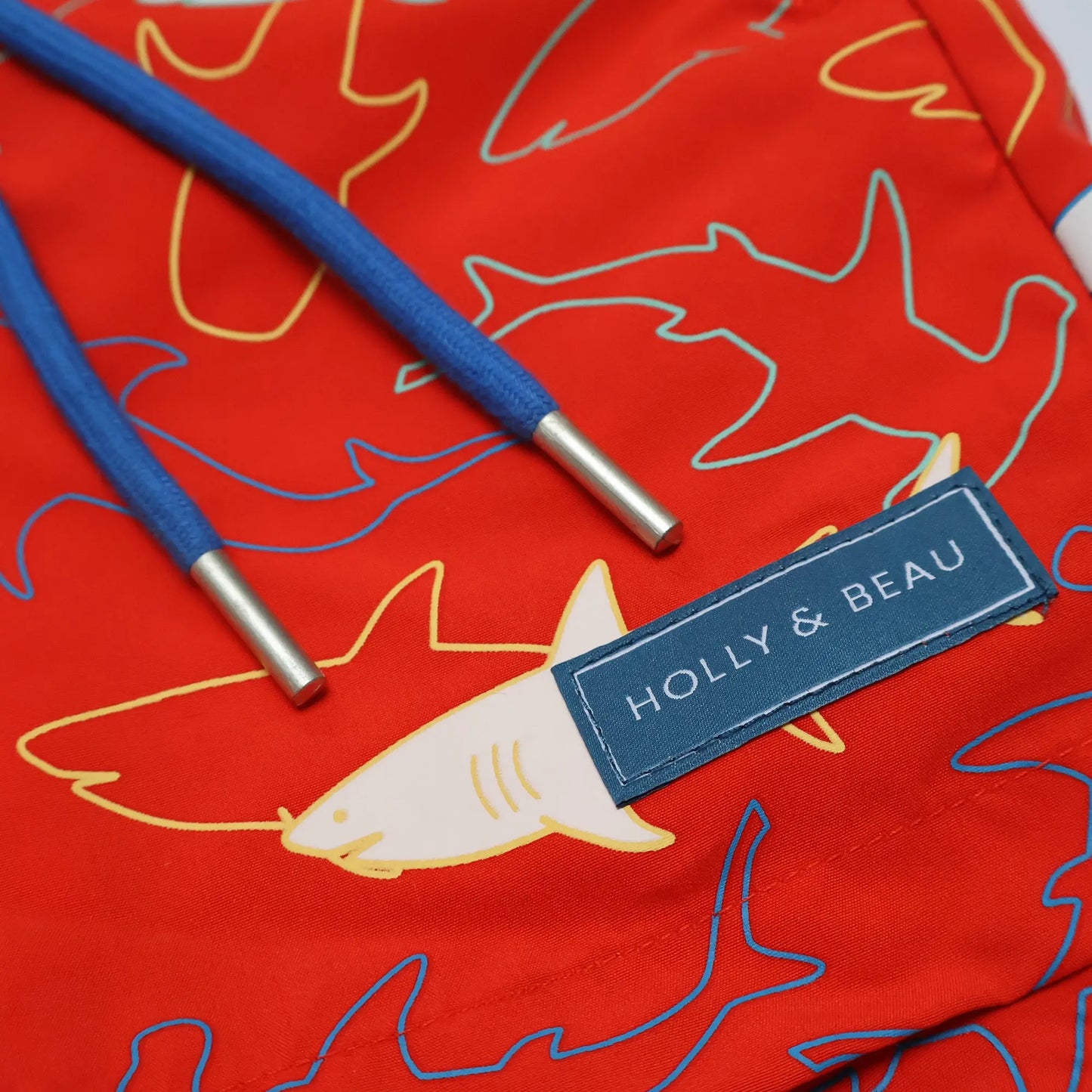 Holly and Beau Red sharks boys colour changing swim shorts. Front drawstring and logo