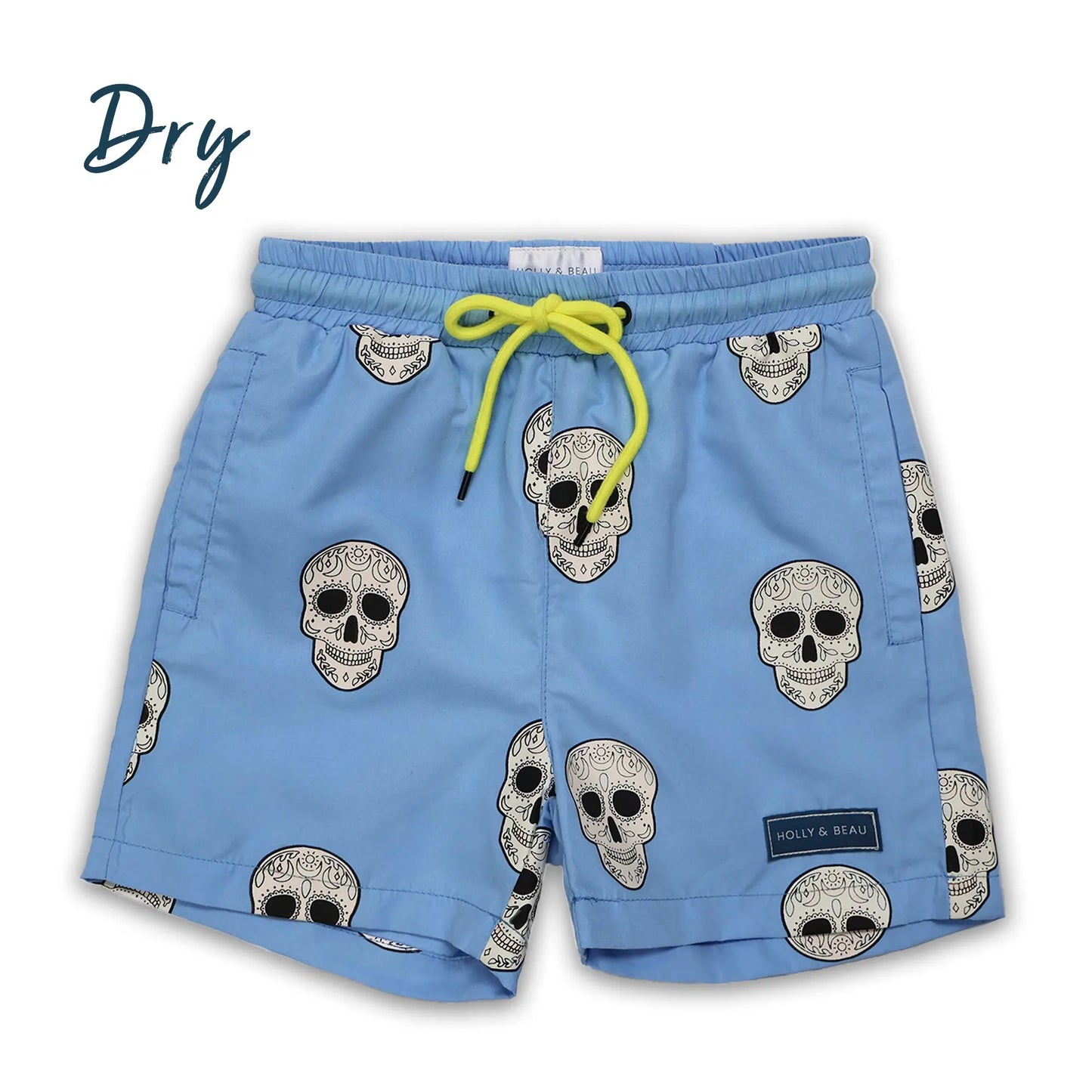 Holly and Beau Light Blue swim shorts with skull patterns on a white background