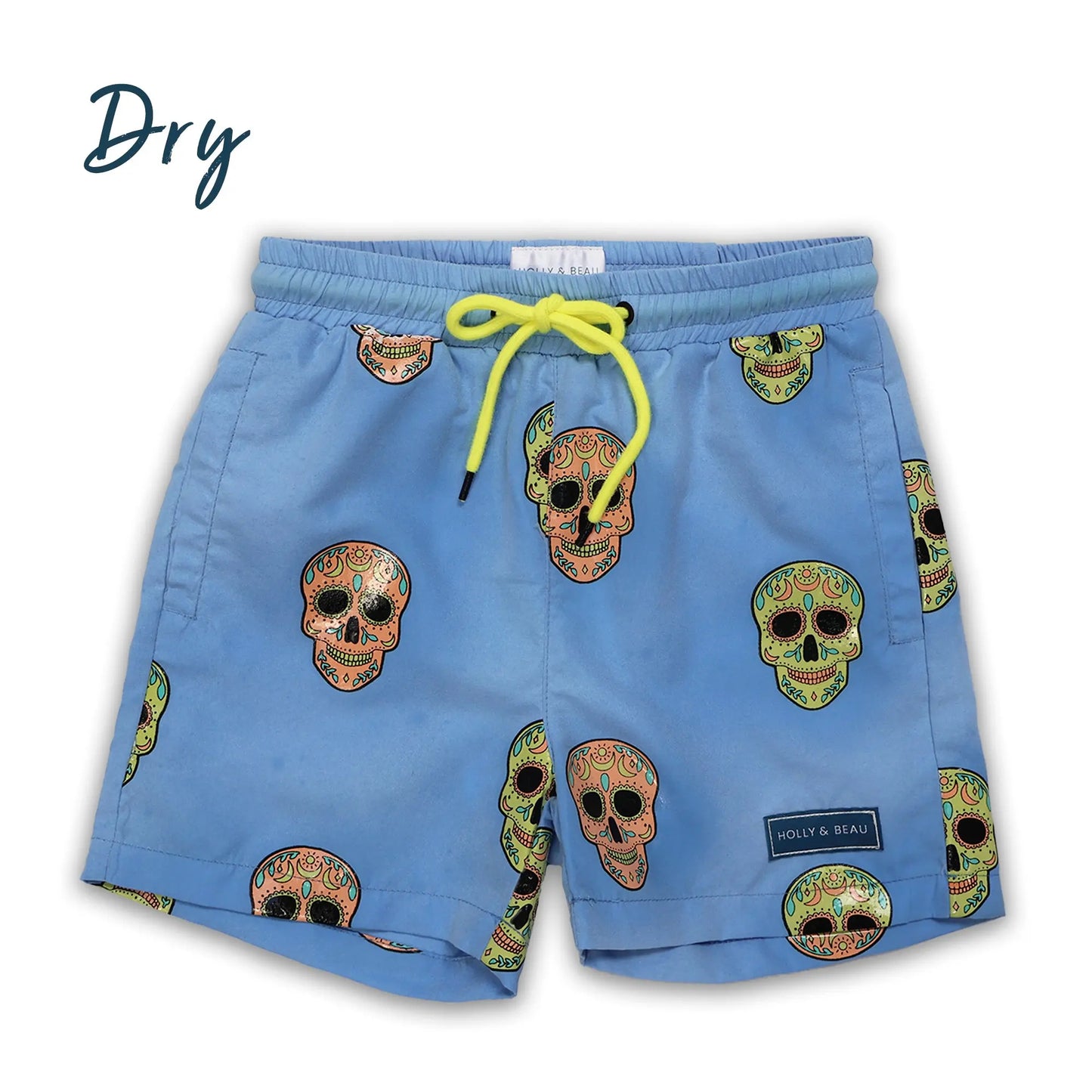 Holly and Beau Light Blue swim shorts with skull patterns and a yellow drawstring on a white background