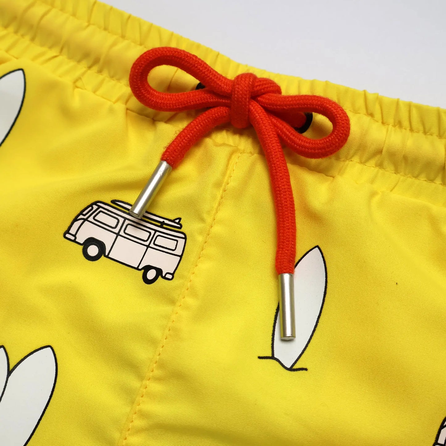 Holly and Beau Yellow surfboards boys colour changing swim shorts detailed front view of the drawstring 