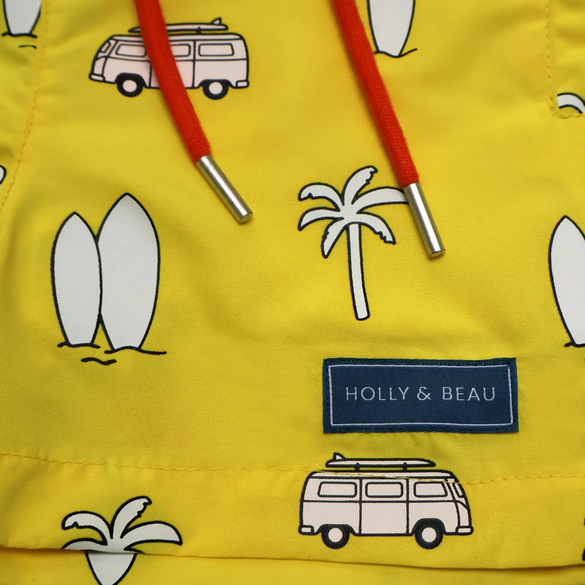 Holly and Beau Yellow surfboards boys colour changing swim shorts detailed front view of the drawstring and logo