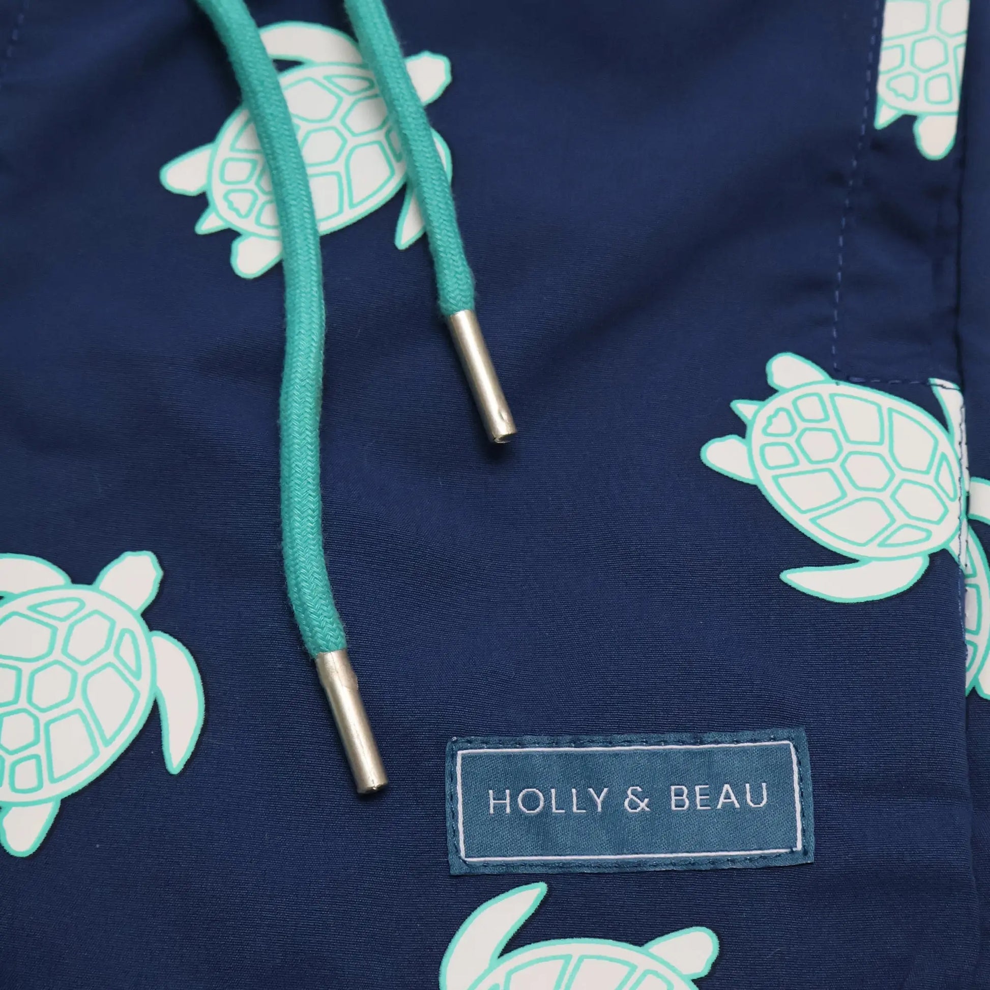 Turtle design detail drawstring and logo view colour changing boys swim shorts by Holly and Beau