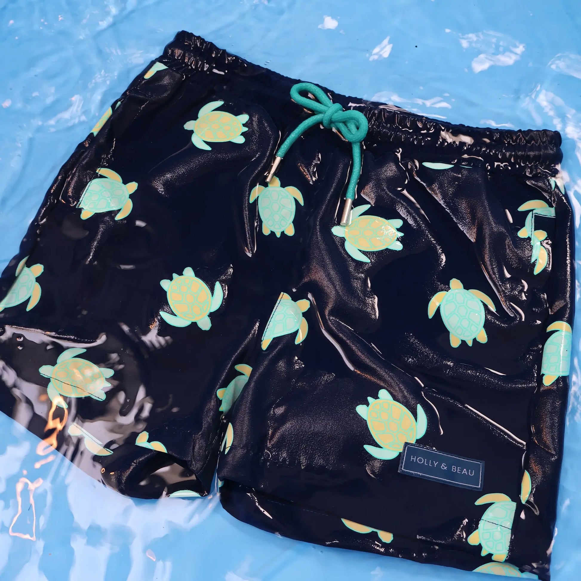 Turtle design in the water, colour changing boys swim shorts by Holly and Beau