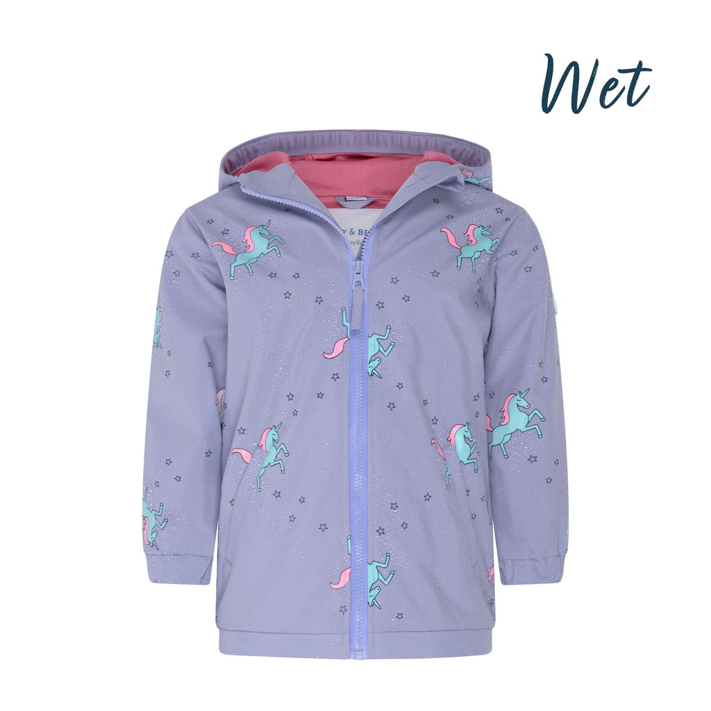 Girls unicorn colour changing raincoat by Holly and Beau. Front wet view of the colour changing girls raincoat.