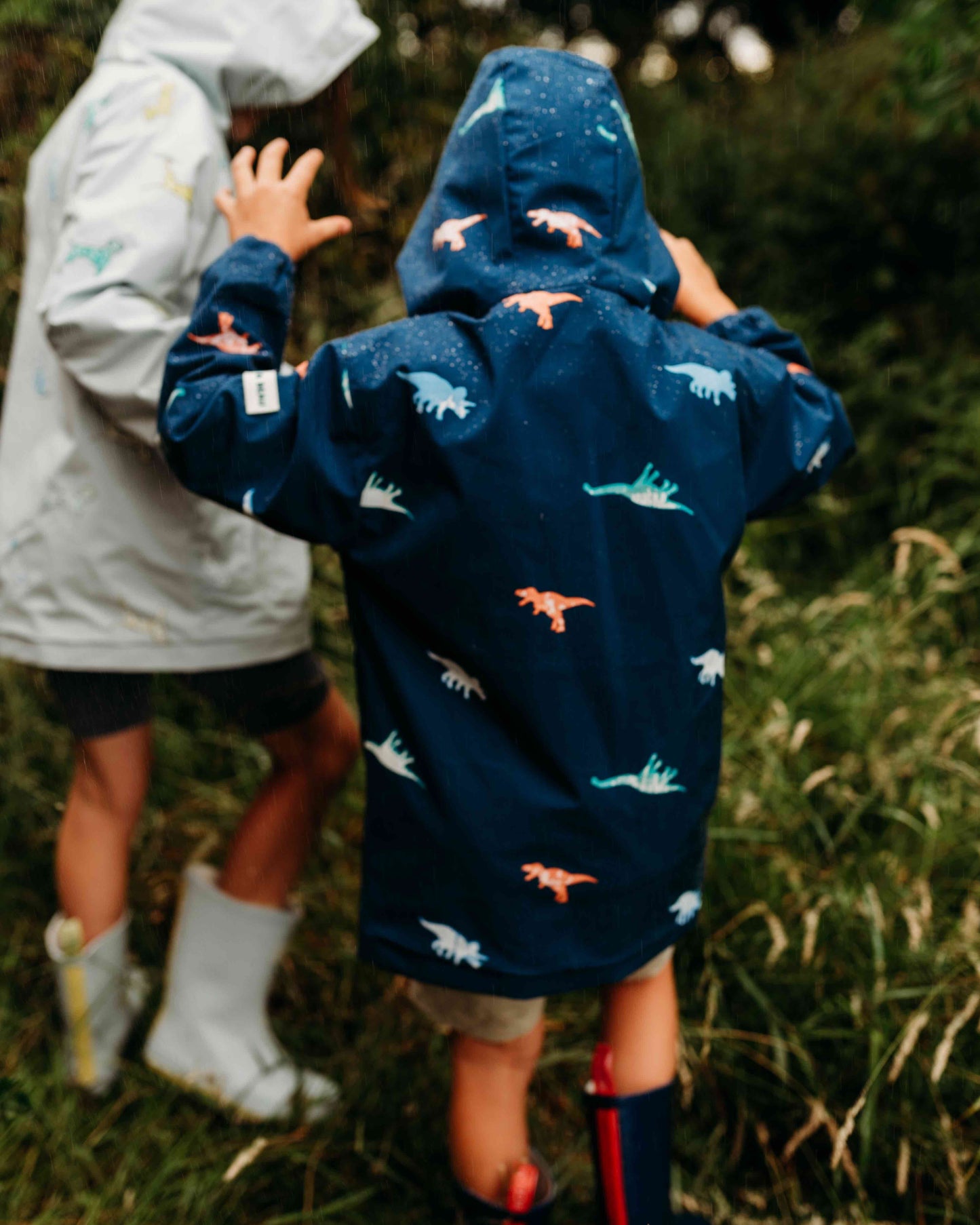 Holly and Beau Outdoor adventures in the dinosaur colour changing raincoat